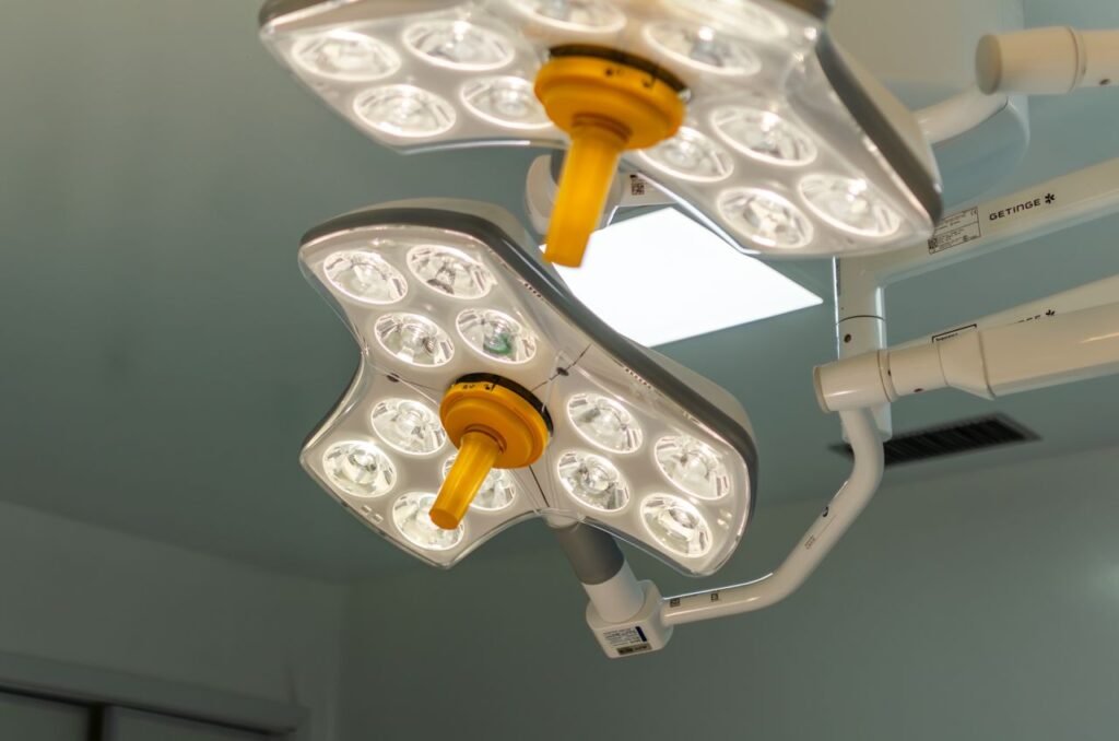 Bright LED surgical lights in a hospital operating room, emphasizing technology and healthcare.